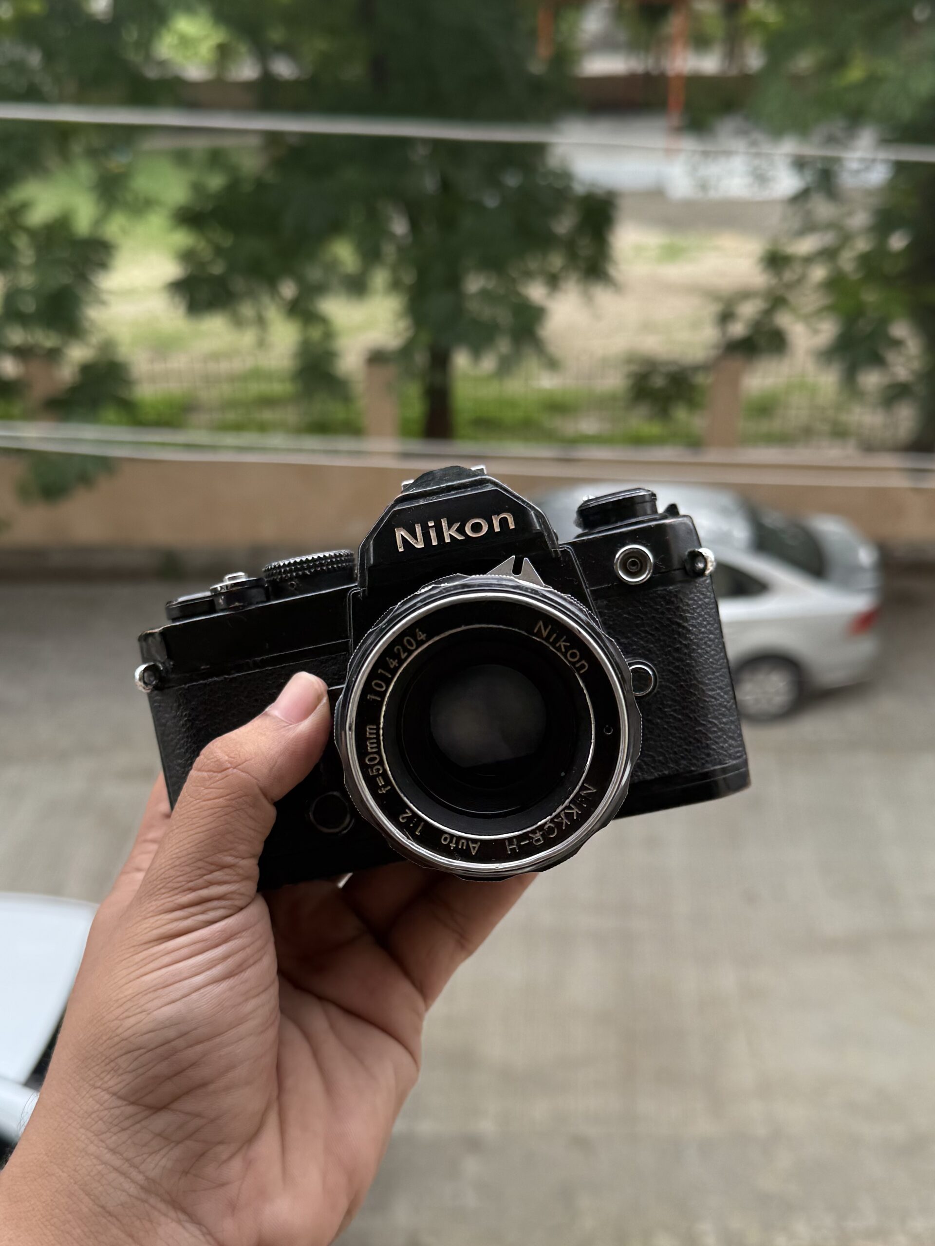 Black Nikon FM paired + NIKKOR-H 50mm f/2 lens, view 8